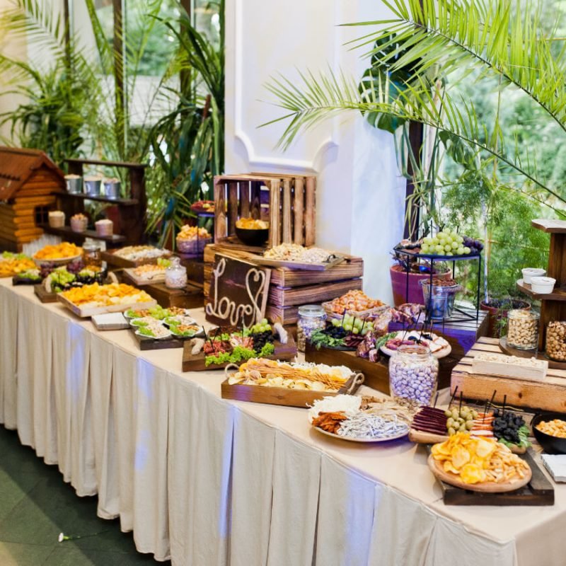 dessert-table-of-delicious-snacks-on-wedding-recep-T8JK3GX.jpg